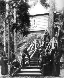 Skhimniks and monks of the Konevsky Monastery of the Nativity near the forest chapel in the Kon-stone. Photograph of the 1900s.